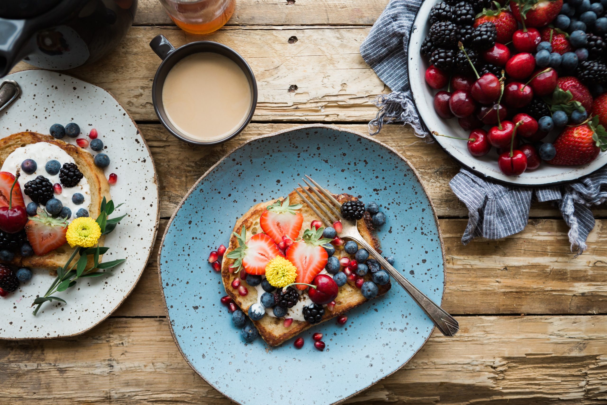 Breakfast Valentine's day plate with strawberries, berries, coffee.